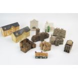 A collection of crested and pottery model buildings, including Exeter Guildhall, Exeter Cathedral,
