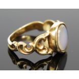 An Antique Unmarked Gold and White Stone Ring with pierced scrolling shoulders, size J, 2.7g