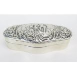 An Edward VII silver box, maker William Comyns & Sons, London, 1907, of cartouche-shaped outline