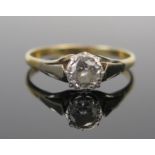 A Diamond Solitaire Ring in an 18ct yellow gold and platinum setting, c. 5.5mm stone, size Q.75, 2.