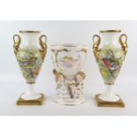 A pair of G Delaney porcelain twin handled vases, of ovoid form, the gilded handles modelled as