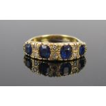 An 18ct Gold, Sapphire and Diamond Ring, 6mm wide head, largest stones c. 5x4.5mm, size P.75, 7.2g