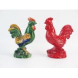 A Dartmouth Pottery model of a cockerel in all-over red glaze, 22cm high, together with a polychrome