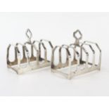 A pair of George VI silver four division toast racks, maker Viners, Sheffield, 1939, of arched