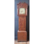 An early 19th century mahogany, oak and crossbanded longcase clock, the arched hood with broken swan