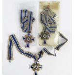 Three Third Reich period Mothers Crosses, includes one bronze and two gold coloured examples, with