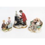 A Capo di Monte porcelain figure group of two elderly gentlemen seated in a sofa, 18cm wide, a