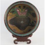 A Chinese polychrome cloisonne bowl, decorated with dragons chasing flaming pearls of knowledge,