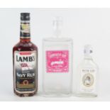 One bottle Sidmouth Gin, One 1/4 bottle Bath Gin and one bottle Lamb's Navy Rum. (3)