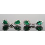 A Pair of 18ct White Gold, Emerald and Diamond Pendant Earrings formed as twin pear drops, one
