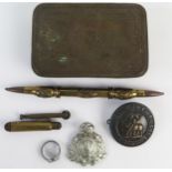 A World War One Princess Mary presentation box, with trench art lighter, pen holder, Sierra Leone