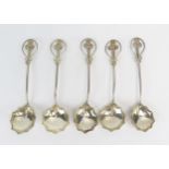 A set of five white metal spoons, with lobed bowls slender stems with foliate terminals, 52gms, 1.