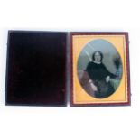 A mid 19th century quarter plate Daguerreotype, of a seated woman, contained in its original Morocco