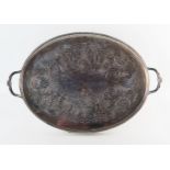 A silver plated oval serving tray, with chased foliate and scroll decoration, galleried border and