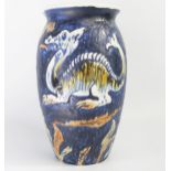 A Dartmouth Pottery vase of ovoid form with low relief decoration of dragons and serpents to a