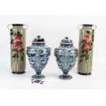 A pair of Hart & Moist, Exeter, pottery vases and covers of ovoid form with moulded ring handles