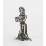 An Elizabeth II silver figurine, 'Orange Girl', maker SMC, London, 1976, 4.5cm high, cased, 25gms