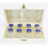 A set of eight silver gilt and enamel mounted clear glass condiments, maker Hroar Prydz, Oslo,