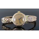 A Ladies ACCURIST 9ct Gold Wristwatch on 9ct gold bracelet with gold springs, 22.8g gross. Running
