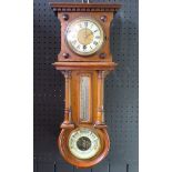 An Edwardian mahogany combination wall timepiece, of rectangular outline, with dentil moulded