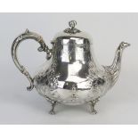 A Victorian silver teapot, maker Fenton Brothers, Sheffield, 1870, crested, of squat ovoid form, the