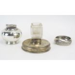 A clear glass and silver mounted ashtray and vesta holder, a Sterling silver ashtray and a