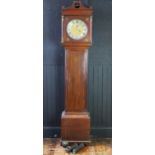 An early 19th century oak longcase clock, the arched hood with fluted columns, the trunk having a