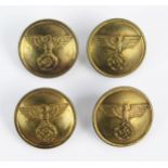 Four Third Reich period brass buttons, with national emblem