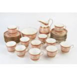 A Minton porcelain part tea service with banded pink scrolling pattern decoration, includes, cups,