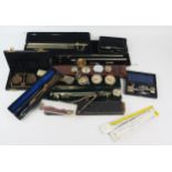 A collection of assorted drawing instruments, slide rules, rulers, drawing pens and assorted