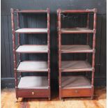 A matched pair of 19th century mahogany five tier whatnots, each square tier raised on ring turned