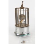 An automaton bird timepiece, with hours and minute reels, pointer and bird contained in a cage, 14cm