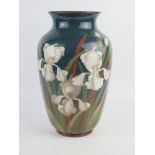 A Langley ware pottery vase of ovoid outline, decorated with white irises, 35cm high.