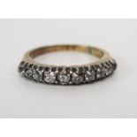 A Georgian Old Cut Diamond Half Eternity Ring set with ten stones of varying size (c. 1.9-2.8mm),