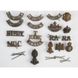 A collection of British army brass shoulder badges, includes, Suffolk Regiment, North Midland
