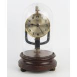 An early 20th century Boulle electric timepiece, with 9cm silvered Arabic dial, pulse pendulum,