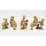 A collection of Hummel figurines of young children by the Goebel and Friedel factories.