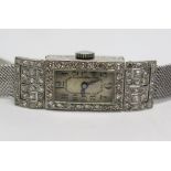 A Platinum and Diamond Cocktail Watch on 9ct white gold bracelet, 17.6g without movement. Movement