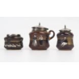 Taylor Tunnicliffe & Co, a pottery and silver mounted three-piece condiment set, with painted