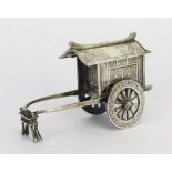 A Chinese silver model of a bridal cart, the slide-off roof with mythical bird decoration, raised on