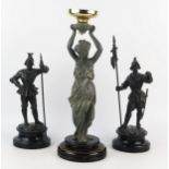 A pair of spelter figures of 17th century style soldiers, mounted on ebonised socle bases, 35cm