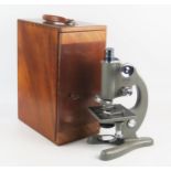 Beck, London, a Model 47 grey enamel monocular microscope, with fine and course rack and pinion