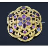 An Antique Purple Paste Brooch in a yellow metal mount, probably 15ct gold, 35mm diam. x 12mm
