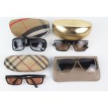 Two pairs of Burberry sunglasses contained in cases, a pair of Helena Rubenstein sunglasses, in a