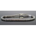 A 7" 18ct White Gold and Diamond Line or Tennis Bracelet, 5.11ct brilliant round cut stones, 9.2g,