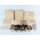 A collection of naval officers epaulettes, cap badges, buttons, together with naval charts for the