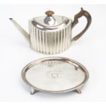 An old Sheffield plated teapot, of oval form with reeded sides and spout, 28.5cm long, together with