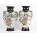 A large pair of Japanese pottery vases of ovoid form decorated with Samurai warriors and flowering