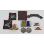 A Parachute Regiment cloth shoulder patch, two Pegasus cloth flashes, Royal Artillery cap badge, and