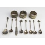 A collection of assorted Indian and other silver wares, includes napkin rings, coffee spoons, butter